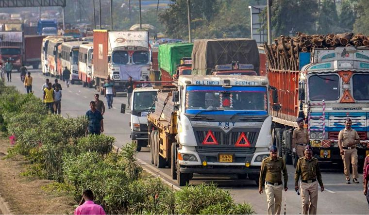 Trucks are parked on a highway amid 'rasta roko' protest by truck drivers in Nagpur on Tuesday, January 2, 2024